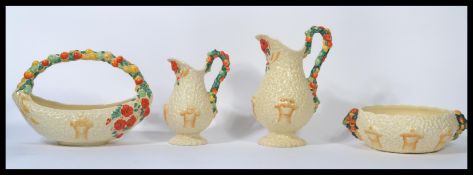 Clarice Cliff - A collection of four pieces of Clarice Cliff ' Celtic Harvest Ware ' ceramics to