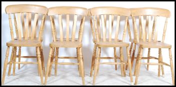 A set of 8 antique style beech wood Windsor style dining chairs. Raised on turned legs united by