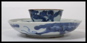 A believed 19th century blue and white Chinese finger bowl and saucer along with a similar plate.