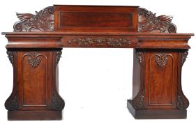 A 19th century Regency mahogany twin pedestal sideboard. Raised on twin pedestals with plinth
