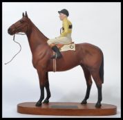 A Beswick Model of Arkle with Pat Taaffe up from the Connoisseur Horses Series No. 2084. Measures