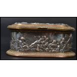 A 19th century Victorian copper and brass jewellery box having silver overlay with relief scenes