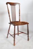A pair of 19th century elm hoop back dining chairs together with another 19th century chair having a