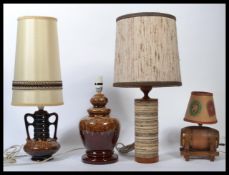 A collection of four retro vintage table lamps to include a mid century point of sale advertising