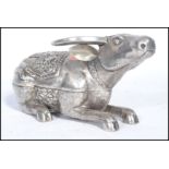 A Chinese silver lidded pot in the form of an Ox /