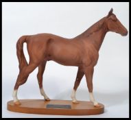 A Beswick Connoisseur model of The Minstrel, matt glaze, on an oval wooden base with label '