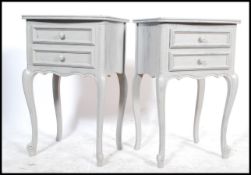 A Pair of 20th century shabby chic French painted bedside chests. Each with drawers having shaped