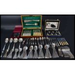 A large collection of silver plated wears along with a group of silver hallmarked flatware.