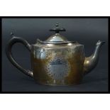 A late VIctorian silver hallmarked teapot by Walker & Hall with ebonised handle.Sheffield