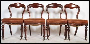A set of 4 good Victorian mahogany kidney back dining chairs. Raised on reeded tapering legs with