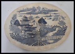 A 19th Victorian James Green and Nephew of London blue and white ceramic Willow pattern meat