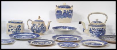 A good collection of vintage blue and white Staffordshire ceramics in the Willow pattern, dating