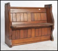 A 19th century pine eclesiastical church pew of shaped form being of small proportions. The