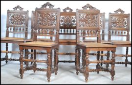 A set of 7 French country oak Brittany provincial dining chairs having rattan weave seats raised