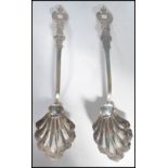 A pair of American silver 13/16 purity serving spo