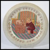 A 19th century Victorian ceramic dog bowl depicting a small dog sat on a wicker basket with boy in