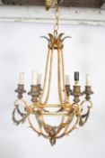 A vintage early 20th century French painted tole chandelier having scrolled arms and hanging chain