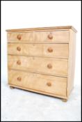 A Victorian satin walnut chest of drawers being raised on bun feet with 2 short drawers over 3