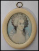 An 18th century portrait miniature painting on ivory of a lady in traditional dress set to an