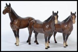 A group of three Beswick ceramic horses to include a pair of Quarter Horses and a The Winner