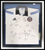 A framed and glazed Bath Rugby shirt from the 2000 / 2001 season signed by all the squad players