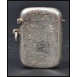 A silver hallmarked match Vesta case having a fitted hinged lid, chase decorated with foliate design