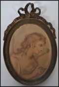 A 19th century Georgian oval miniature picture frame having an Angelica Kauffman print of an