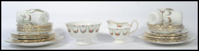 A vintage early 20th century Edwardian bone China chintz pattern  tea service consisting of tea