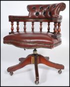 An antique style 20th century Ox blood buttoned back leather Captains style swivel desk office