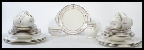 A Royal Doulton tea and dinner service in the Infinity pattern H5111 consisting of six tea cup ,