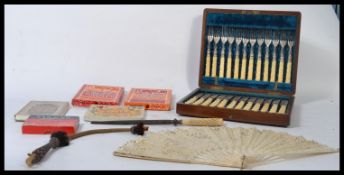 A collection of mixed curios to include parlour card games, a stunning early 20th century hand