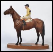 A Beswick Model of Arkle with Pat Taaffe up from the Connoisseur Horses Series No. 2084. Measures