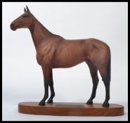 A Beswick pottery "Arkle Champion Steeplechaser" model, MN.2065, matt, on oval wooden base,