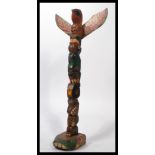 An North Canadian native American Red Indian made Totem pole with eagle top and alternating