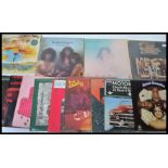 A collection of vinyl long play LP records featuring several artists to include Melvin Van