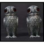 A pair of antique style owl condiments with inset red glass eyes - each stamped 800 (indicating