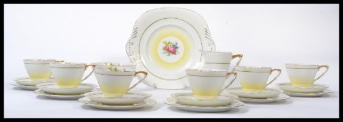 A vintage 20th century Art Deco hand painted bone China tea service stamped for Royal Staffordshire