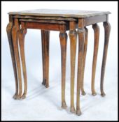 A 20th century trio nest of tables being Japanned