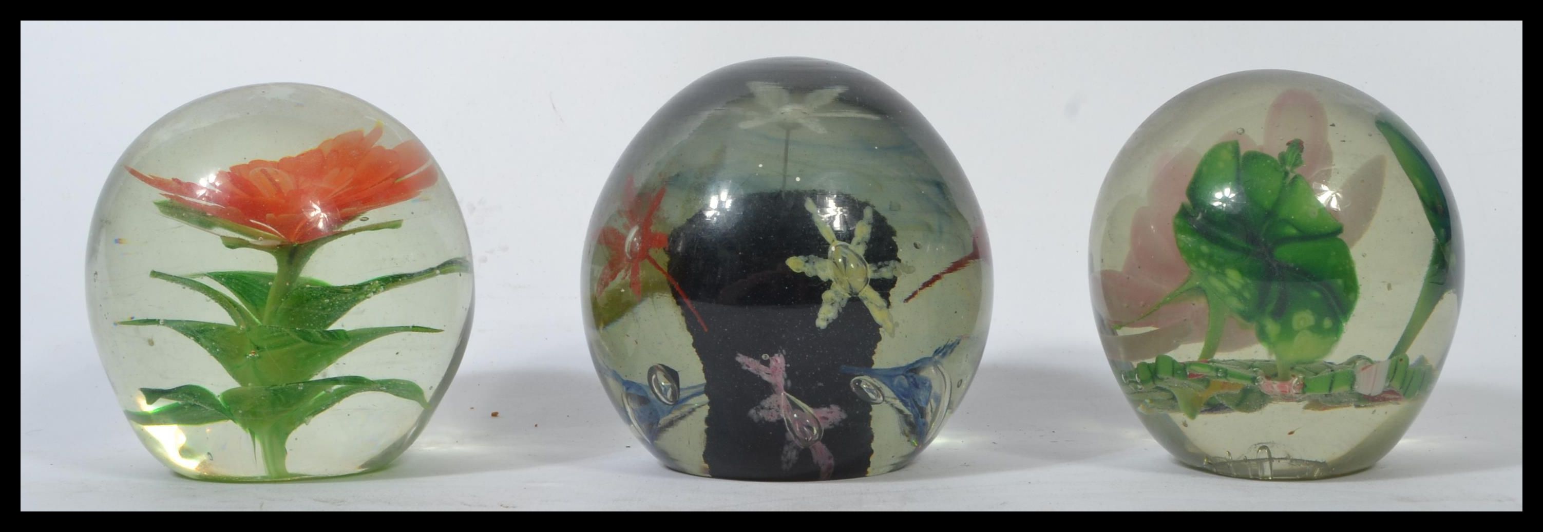 A group of three Nailsea glass 19th century Victorian paperweight glass dumps having inset floral - Image 3 of 6