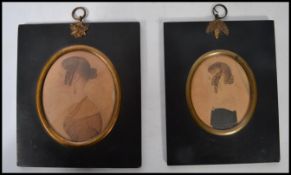 A pair of early 19th century American portrait miniatures watercolour paintings on paper of two