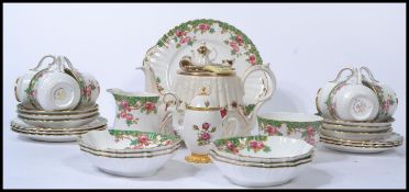 A 20th century novelty bone China Royal Albert Country Roses teapot together with a bone China tea