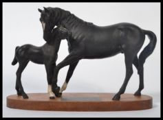 A Beswick model of 'Black Beauty & Foal' on wood base from the Connoisseur collection, measures