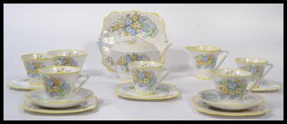 A vintage 20th century Art Deco  Bone China tea service by Bell China decorated with hand painted