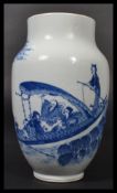 A 19th century blue and white Chinese vase having a tapered neck and rim with hand painted scenes of