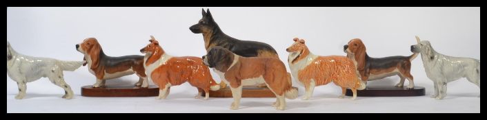 A collection of eight Beswick ceramic figurines of dogs to include a Beswick figure of a St Bernard,