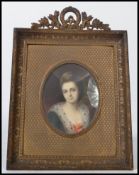 A 19th century Georgian portrait miniature painting on ivory of a lady in traditional dress set to a