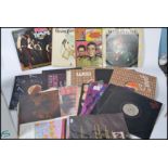 A collection of vinyl long play LP and 12" records featuring many different artists and genres to