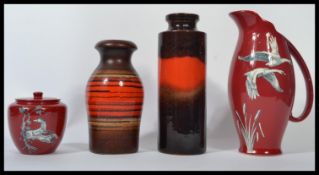 A collection of vintage mid 20th century ceramics to include West German fat lava vases, water jugs,