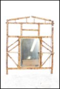 A Victorian 19th century Aesthetic movement bamboo overmantel mirror having central mirror glass