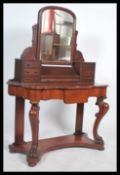 A Victorian mahogany duchess dressing table raised on turned supports with serpentine shaped